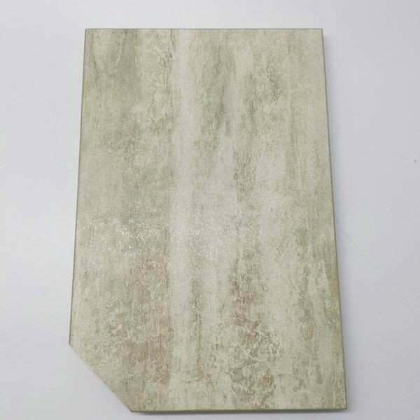 Beige stone-look rectangular tile with subtle texture and beveled corner on white background
