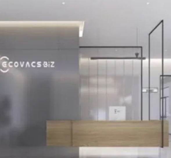 Modern ECOVACS BIZ office reception with minimalist design, wooden desk, glass partitions