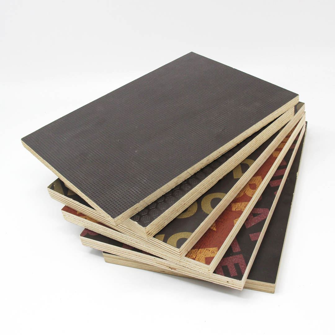 Stack of dark brown film-faced plywood sheets for construction use