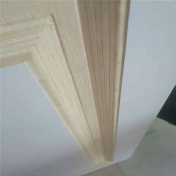 Close-up of layered wooden molding corner with clean geometric trim detail