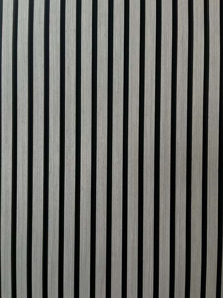 Minimalist black and white vertical stripes with evenly spaced lines creating a bold geometric pattern