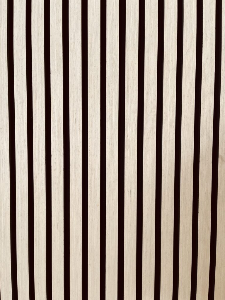 Minimalist beige and black vertical stripe pattern with clean, modern contrast