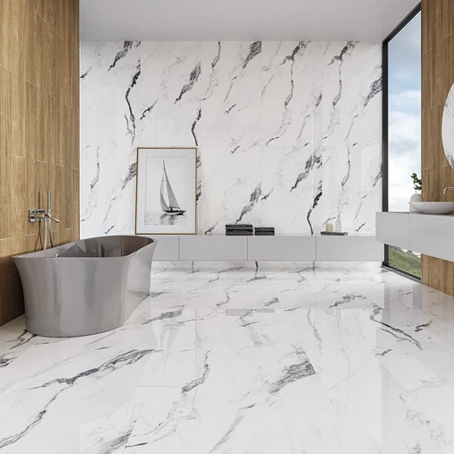 Modern marble bathroom with freestanding tub, wood accents, floating vanity, and natural light