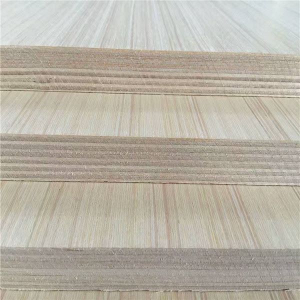 Stacked plywood sheets showing layered edges and natural wood grain texture