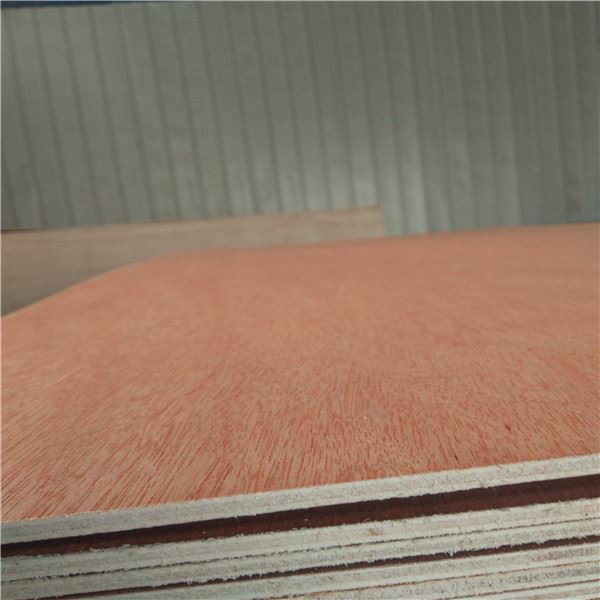 Close-up of stacked plywood sheets showing smooth wood grain and layered edges