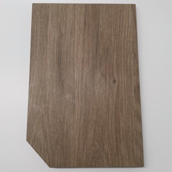 Wood grain laminate panel with vertical grain and diagonally cut bottom-left corner.