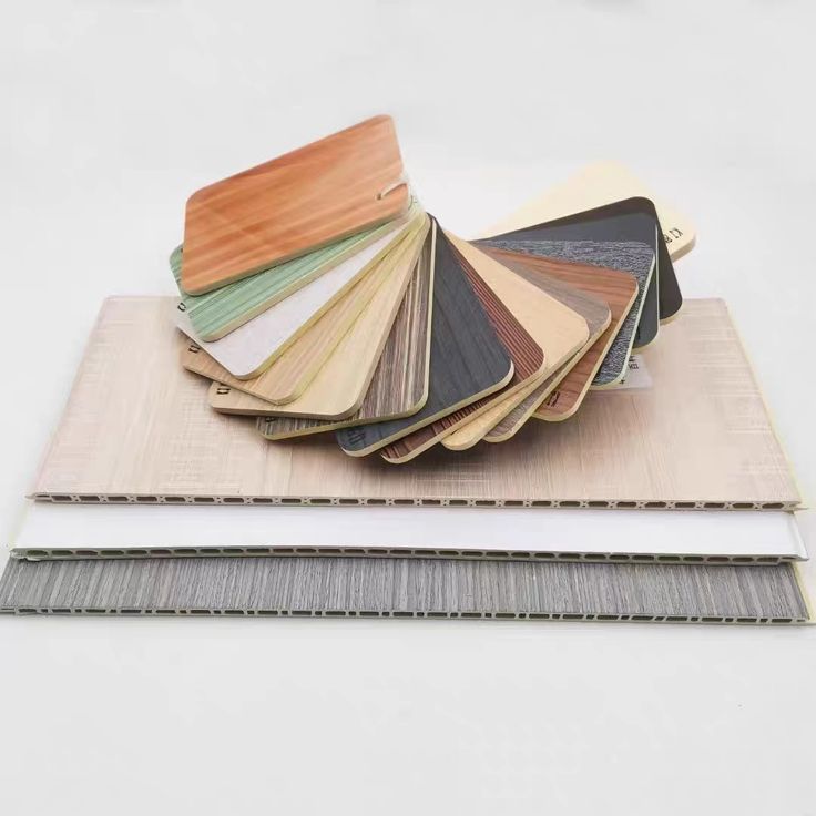 Wood grain PVC wall panel samples showing colors, textures, and hollow core structure