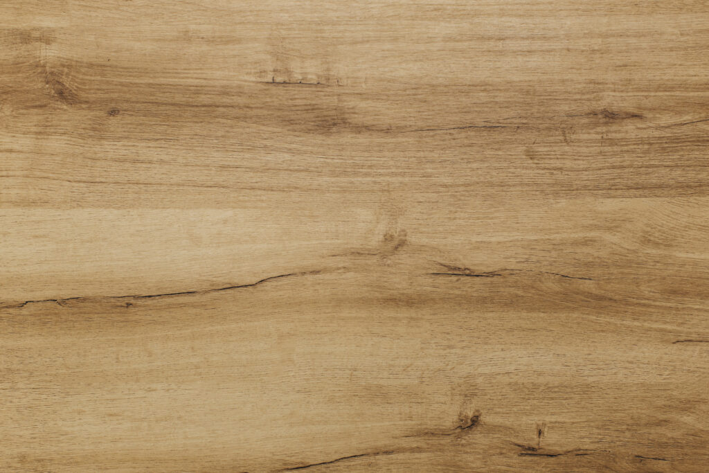 Close-up of warm honey brown wood grain with smooth polished texture